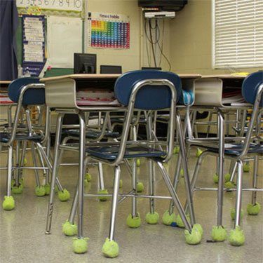 Classroom chairs fitted with tennis balls